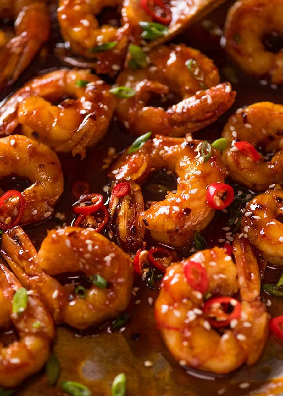 Close up of sticky Asian spicy garlic shrimp