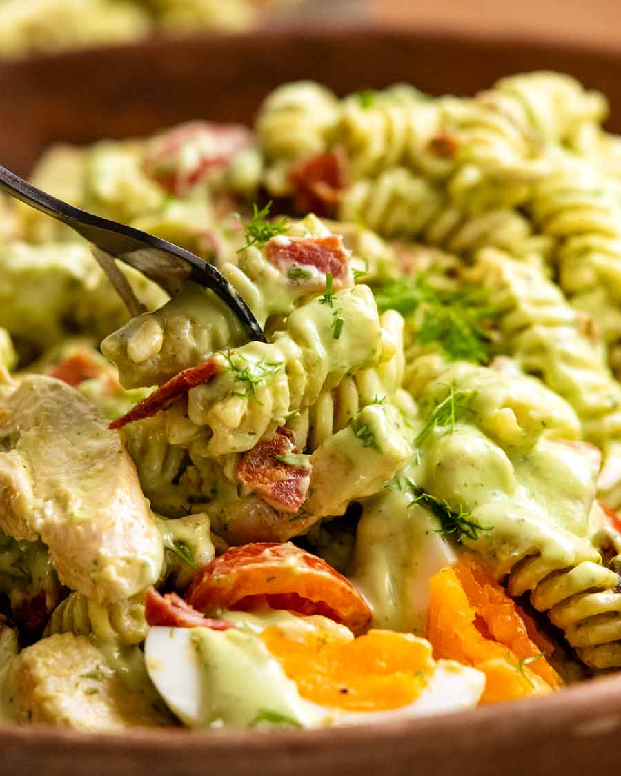 Close up of fork stabbing Pasta Salad with Avocado Ranch Dressing