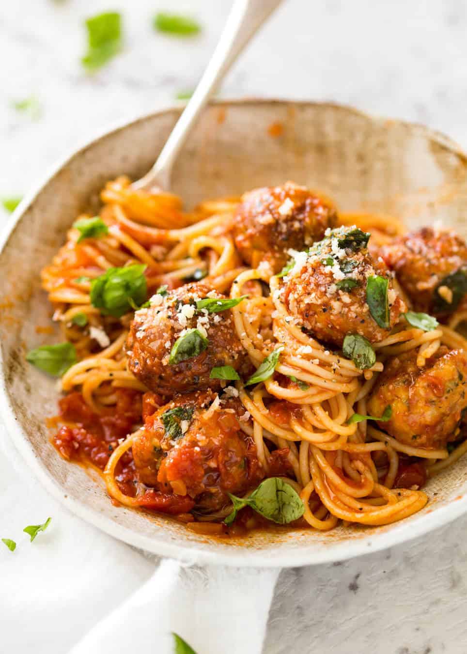 Plump, juicy BAKED Chicken Meatballs and Spaghetti! They come out golden brown on the outside, and so soft and juicy on the inside. recipetineats.com