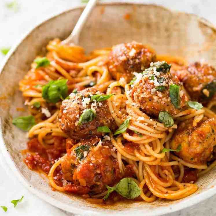 Plump, juicy BAKED Chicken Meatballs and Spaghetti! They come out golden brown on the outside, and so soft and juicy on the inside. recipetineats.com