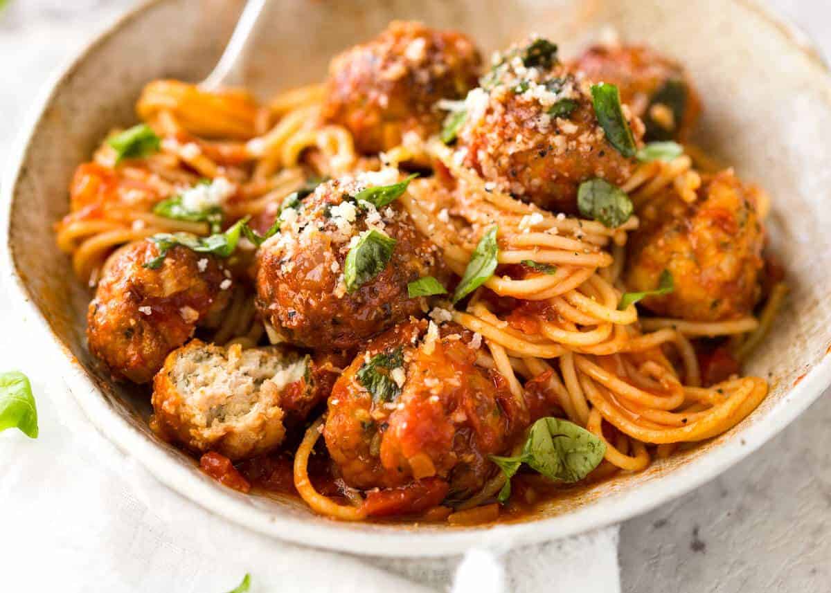 Plump, juicy BAKED Chicken Meatballs and Spaghetti! They come out golden brown on the outside, and so soft and juicy on the inside. recipetineats.com