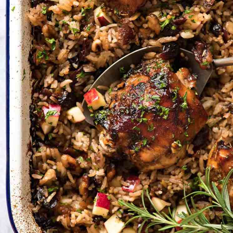 A flavour loaded one-pan, quick midweek dinner - Baked Chicken and Rice Pilaf with Cranberries, Walnuts and Apple. The smell when this is cooking is amazing! recipetineats.com