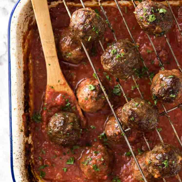 Both the Oven Baked Italian Meatballs AND sauce are made entirely in the oven! The meatballs are extra soft and juicy, and tomato sauce fantastic for pouring over pasta. www.recipetineats.com