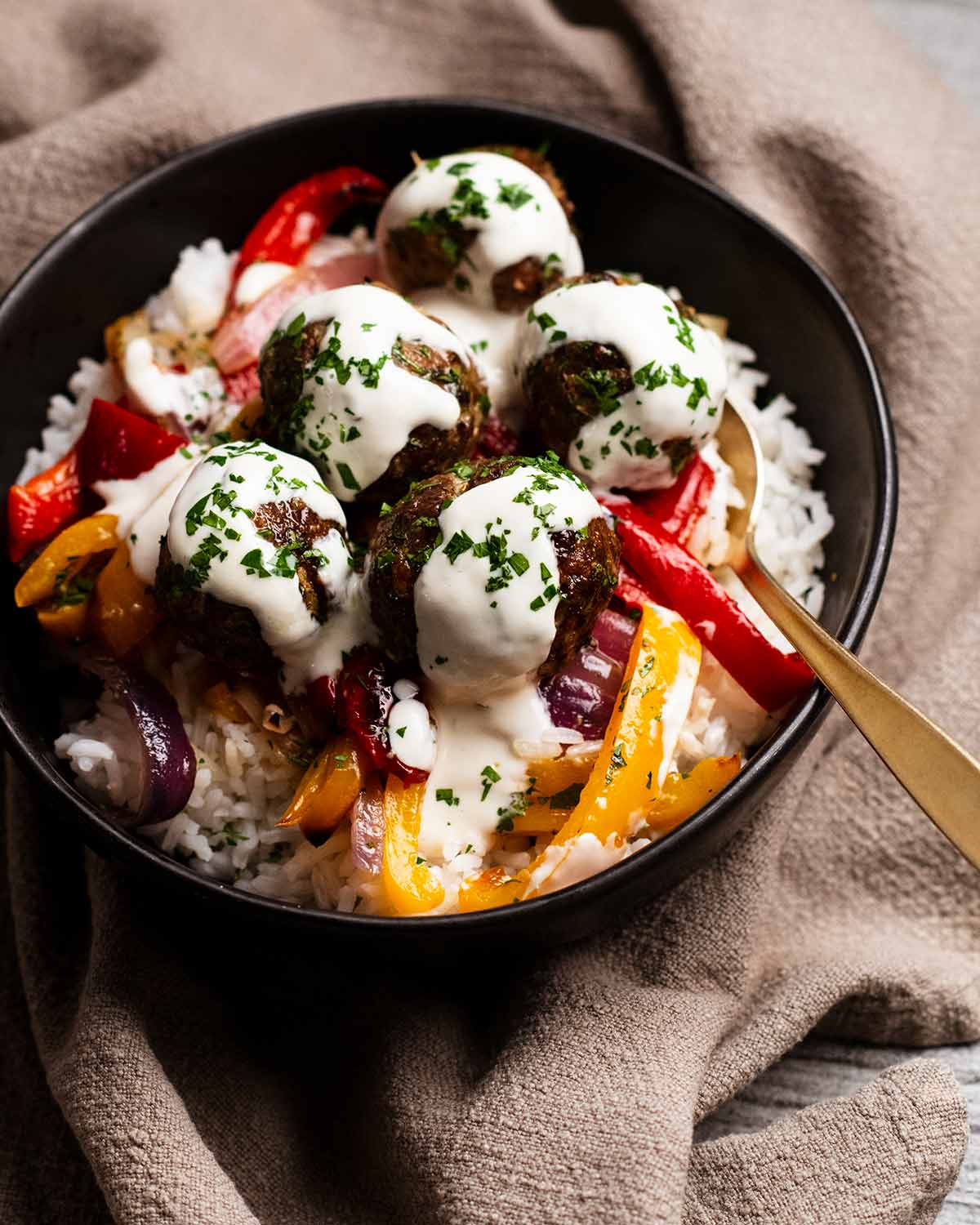 Baked lamb kofta meatballs and vegetables rice bowls