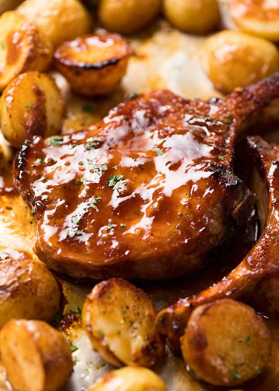 Close up of Oven Baked Pork Chops with potatoes, fresh out of the oven