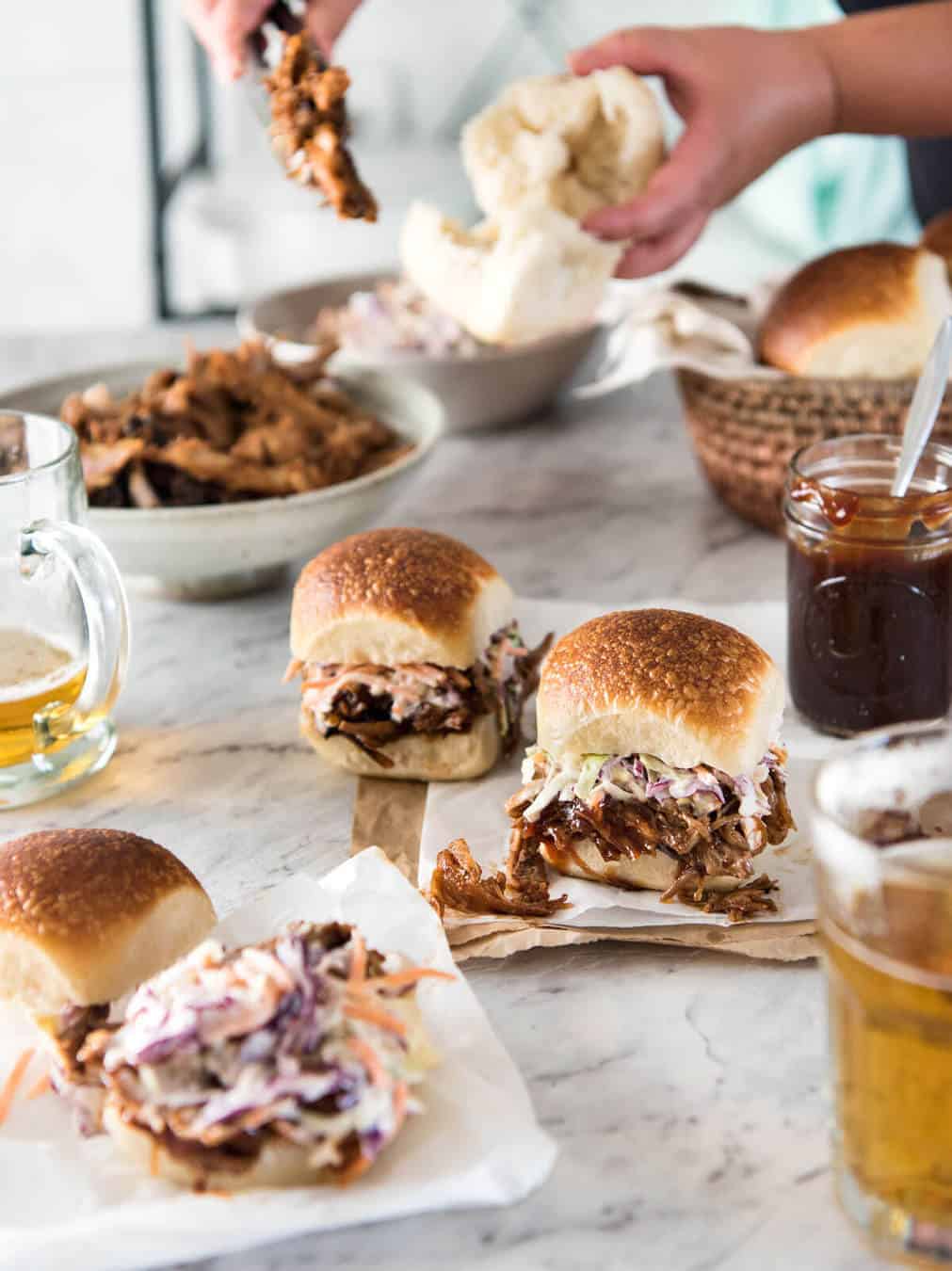 Slow Cooker BBQ Pulled Pork Sandwich - Perfectly seasoned, tender pulled pork tossed in a homemade BBQ sauce, piled onto bread with coleslaw. Slow cooker, pressure cooker or oven. www.recipetineats.com