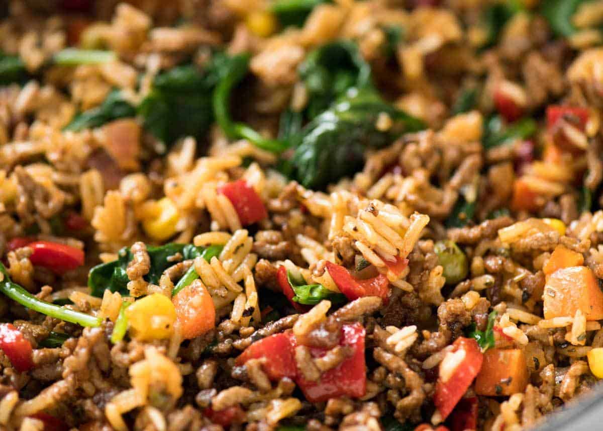 A quick, fabulous midweek meal - this ground Beef and Rice is made by browning ground beef, then cooking it with flavoured rice and loads of veggies. Irresistibly delicious! www.recipetineats.com