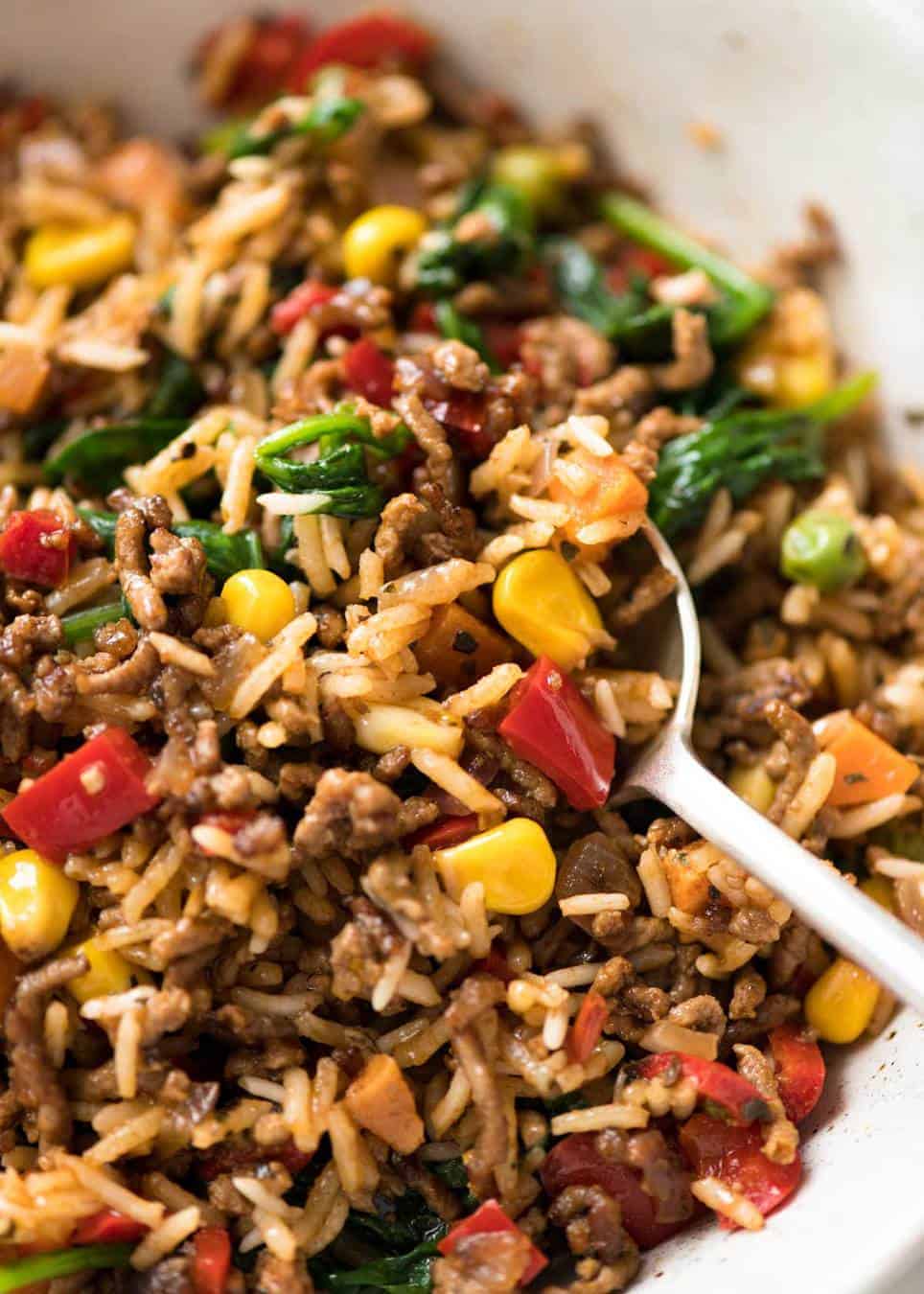 A quick, fabulous midweek meal - this ground Beef and Rice is made by browning ground beef, then cooking it with flavoured rice and loads of veggies. Irresistibly delicious! www.recipetineats.com