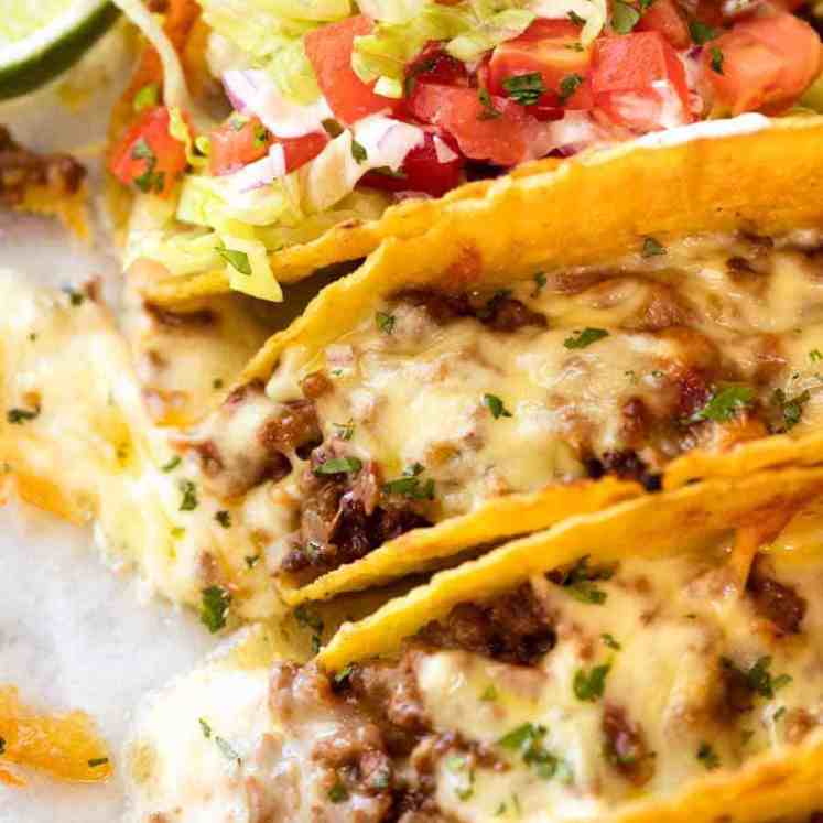 Close up of Beef Taco recipe, fresh out of the oven, with taco meat and melted cheese