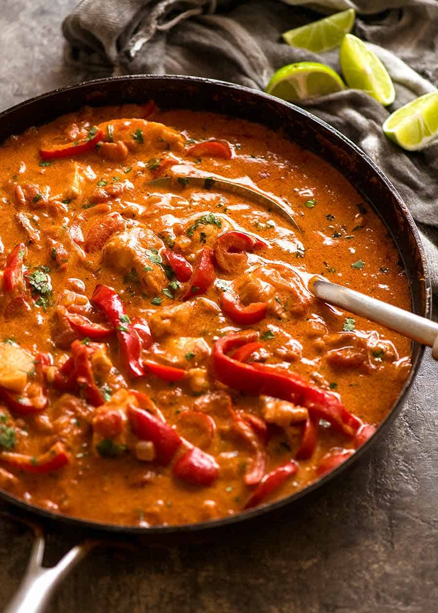 Brazilian Fish Stew in a black skillet, fresh off the stove, ready to be served