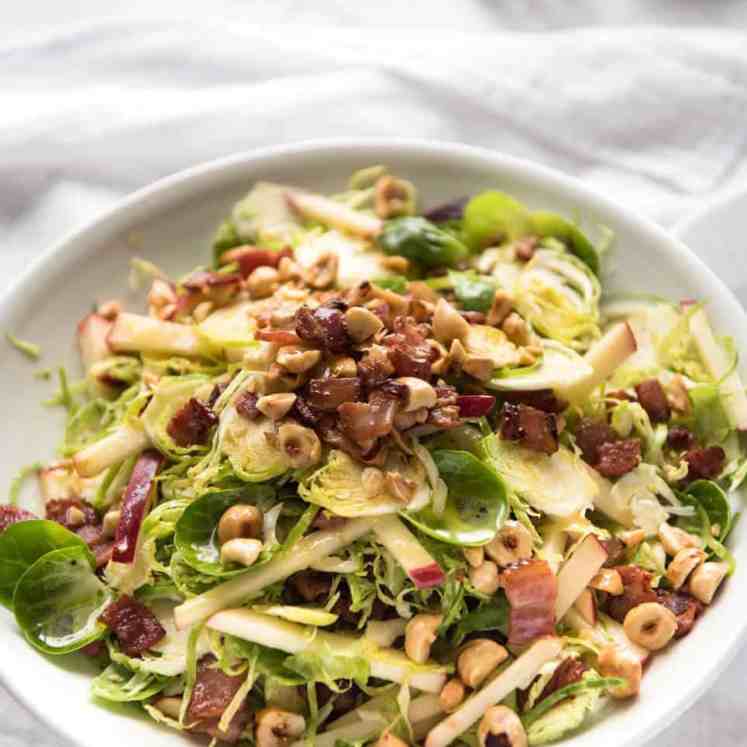 Brussel Sprout Salad - the combination of brussels sprouts, bacon, apple and hazelnuts is a magical combination! recipetineats.com