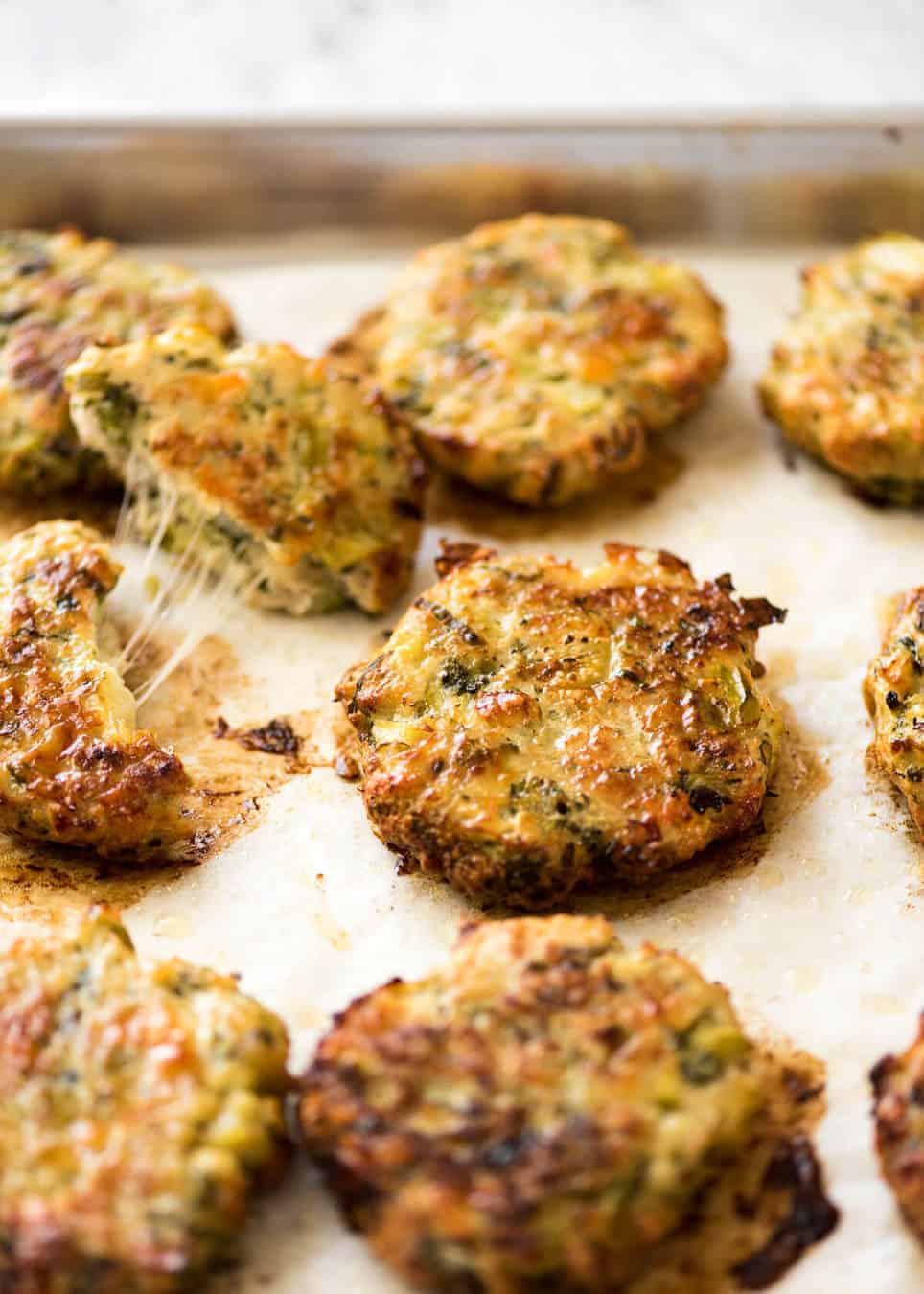 Golden and crispy on the outside, juicy and cheesy on the inside - BAKED Cheesy Broccoli Chicken Patties. recipetineats.com