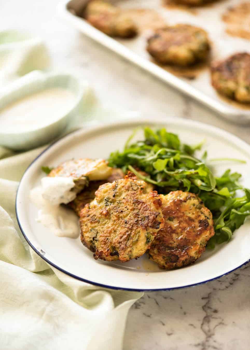 Golden and crispy on the outside, juicy and cheesy on the inside - BAKED Cheesy Broccoli Chicken Patties. recipetineats.com