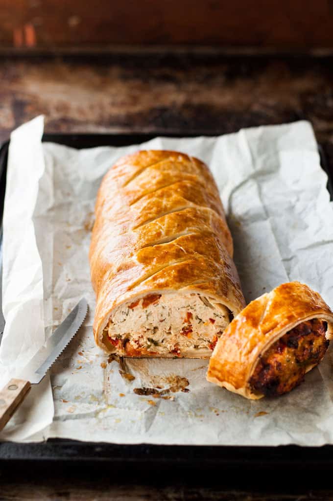 Chicken Meatloaf Wellington sliced, with knife