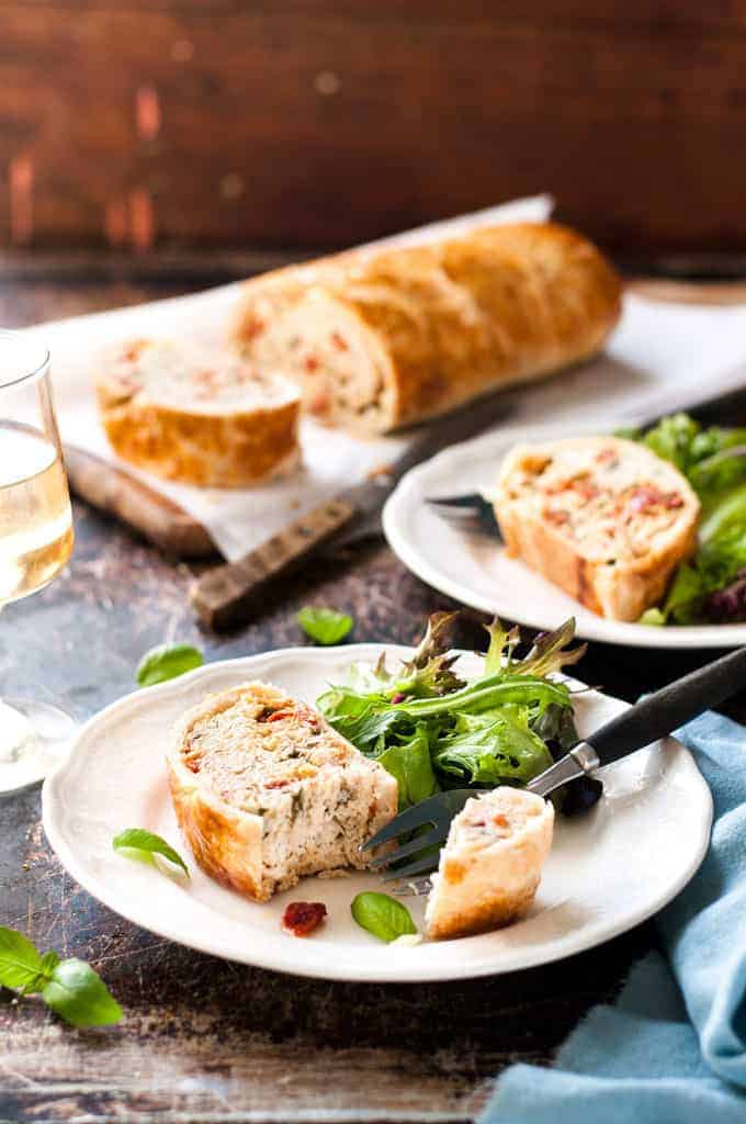 Chicken Meatloaf Wellington sliced and served with salad