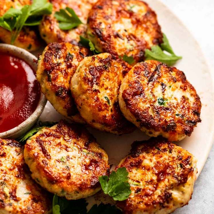 Close up of freshly cooked Chicken rissoles (chicken patties) ready to be served