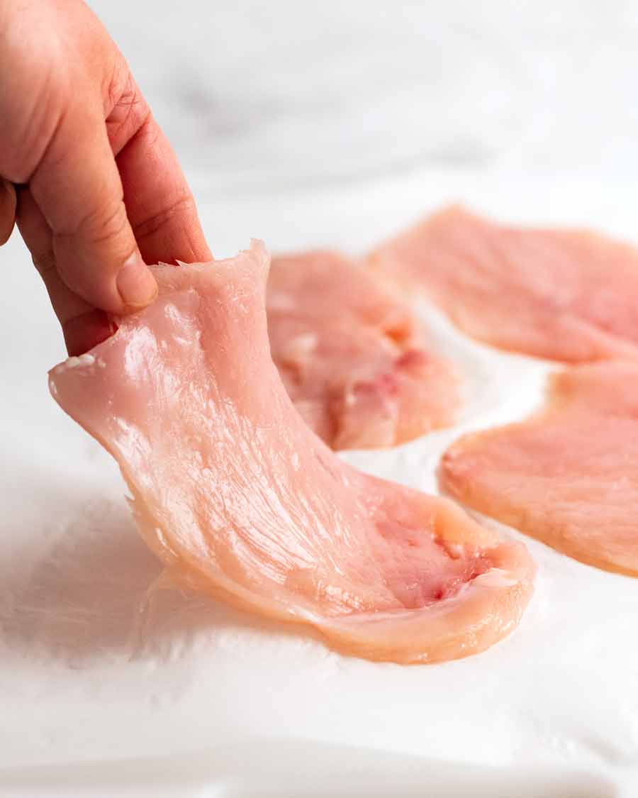 Preparing chicken breast to make Chicken Saltimbocca