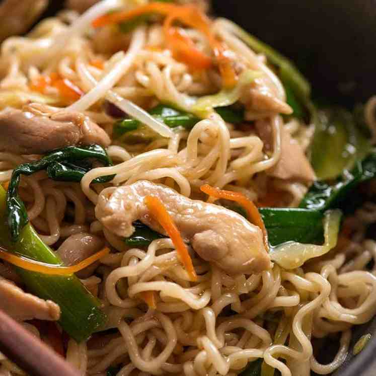 Close up of Chow Mein Ramen Noodles in a rustic black bowl, ready to be eaten