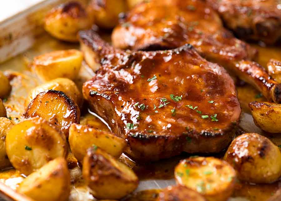 Close up photo of Oven Baked Pork Chops with potatoes, fresh out of the oven