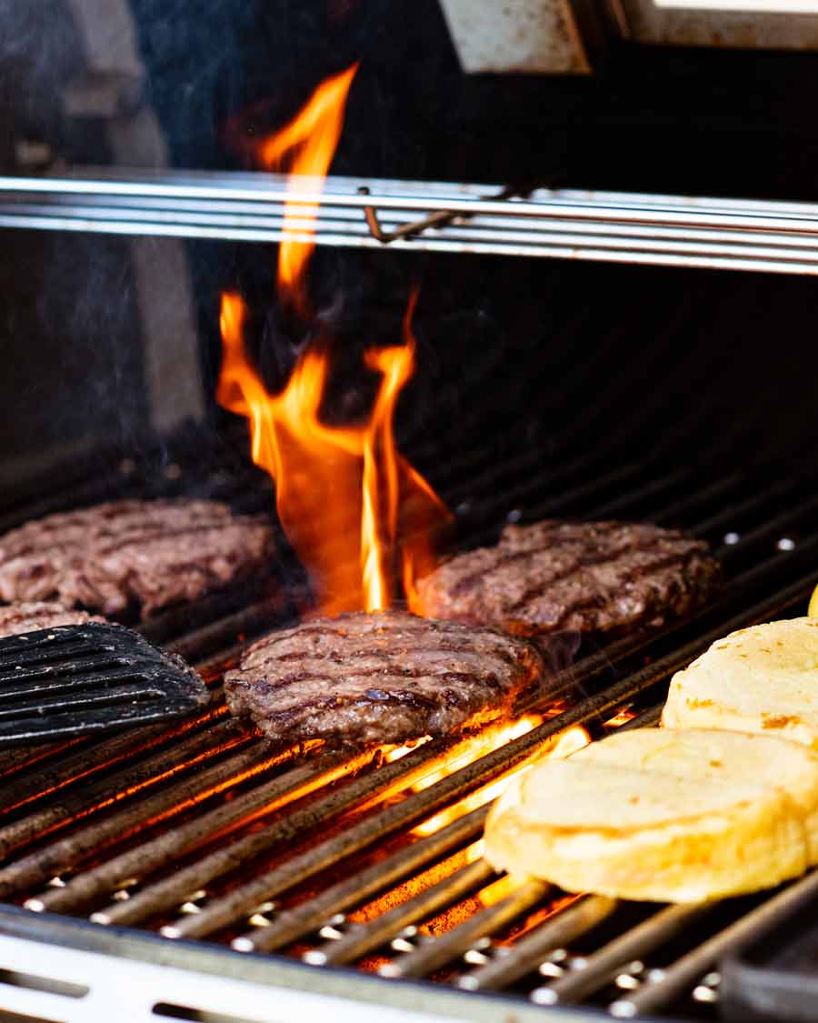 Cooking cheeseburger on BBQ