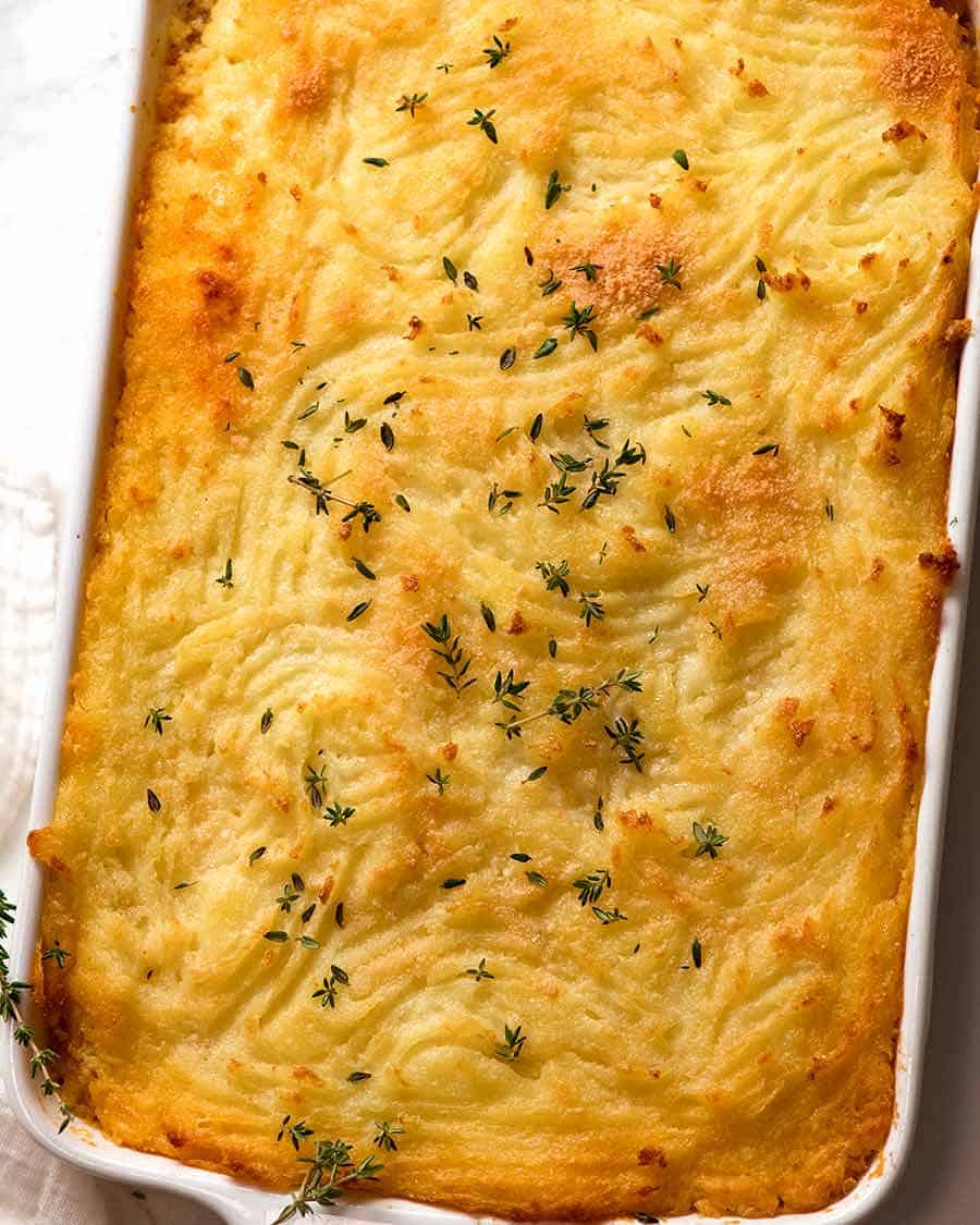 Overhead photo of golden crispy mashed potato topping of Cottage Pie