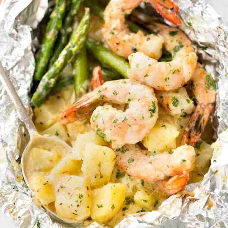 Creamy Garlic Shrimp, Cheesy Potatoes and asparagus - serious contender for the BEST foil packet recipe ever! recipetineats.com