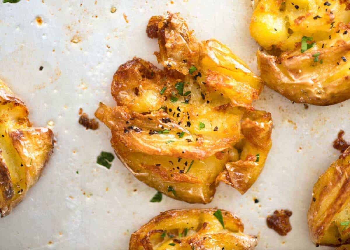 The best, buttery, golden, ultra crispy smashed potatoes you will ever have! www.recipetineats.com