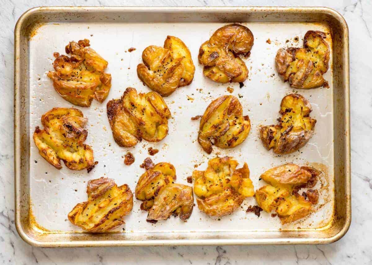 The best, buttery, golden, ultra crispy smashed potatoes you will ever have! www.recipetineats.com