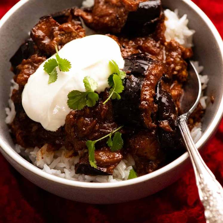 Bowl of Indian eggplant curry on rice