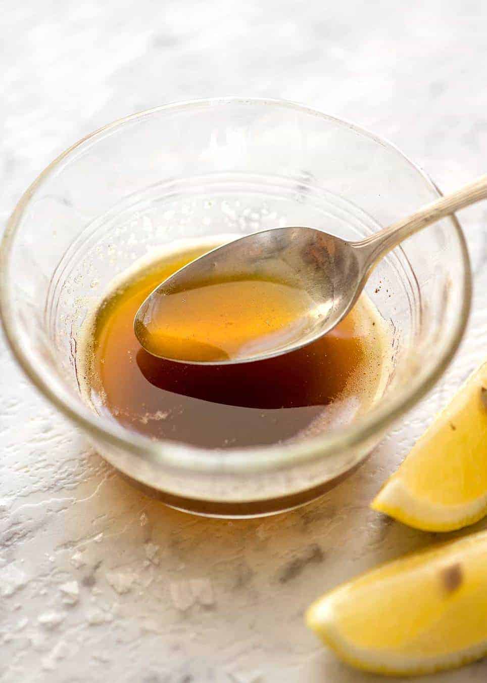 Brown Butter in a small glass bowl with a teaspoon scooping some up.