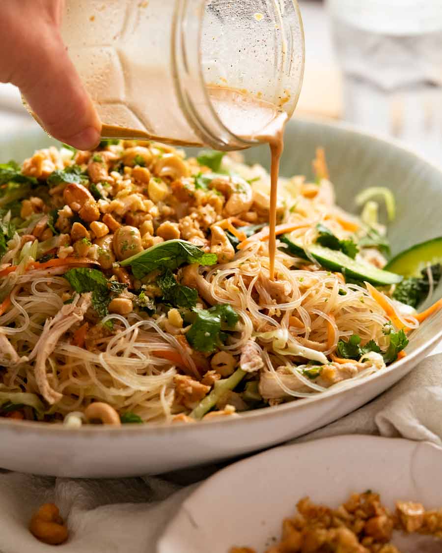 Pouring dressing over Glass noodle salad