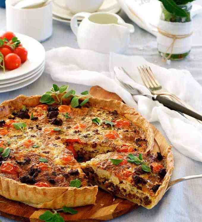 Table setting with whole Italian Sausage Quiche