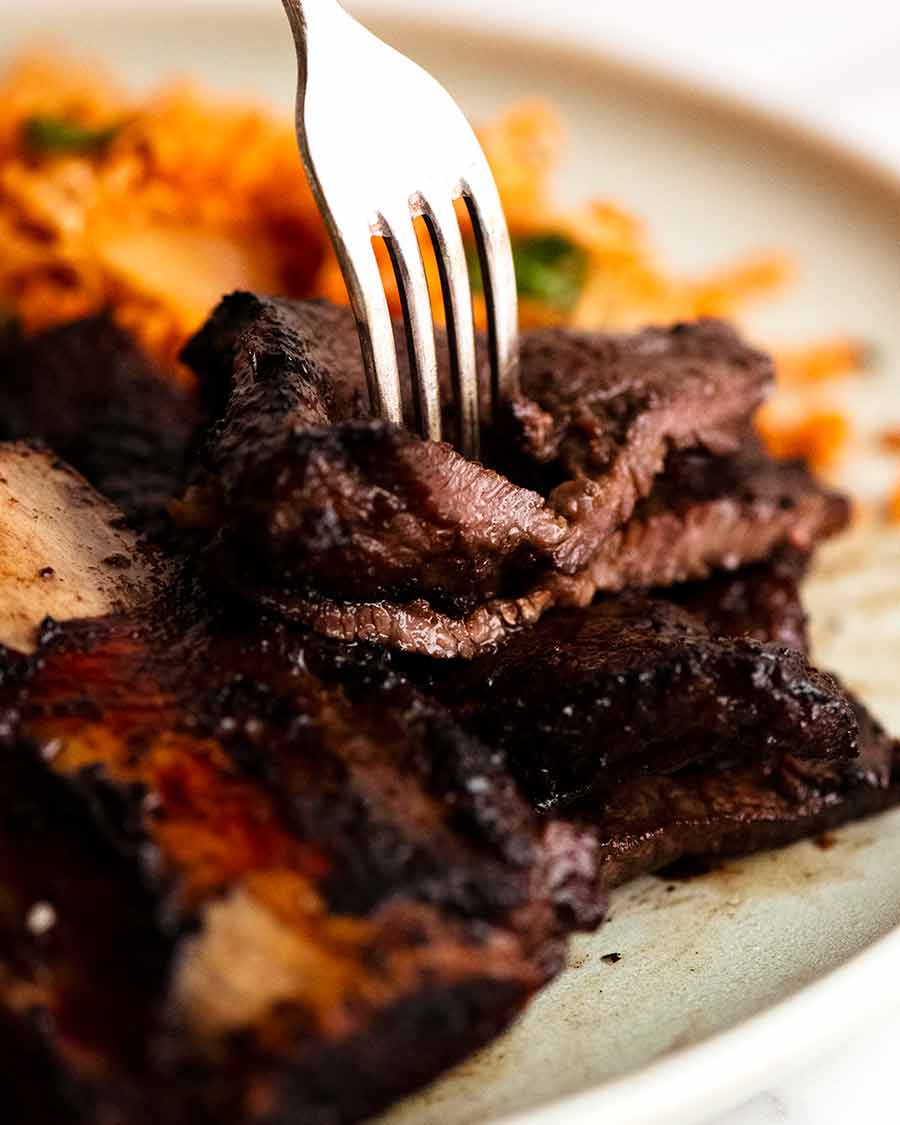 Close up of fork Korean BBQ Marinated Beef Short Ribs (Galbi)