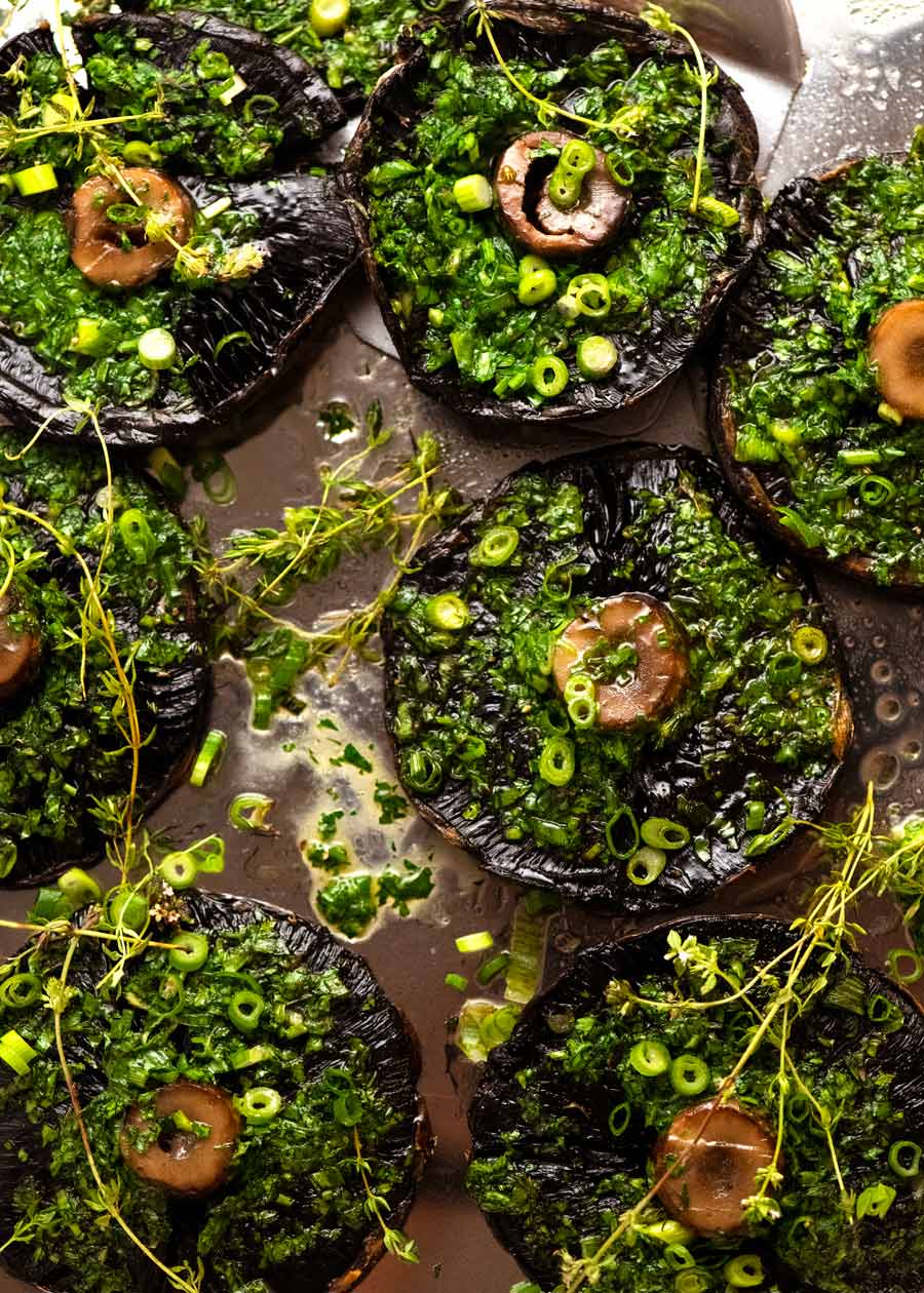 Overhead photo of Roasted Large Mushrooms with Green Onion Thyme Butter on a tray, ready to be served