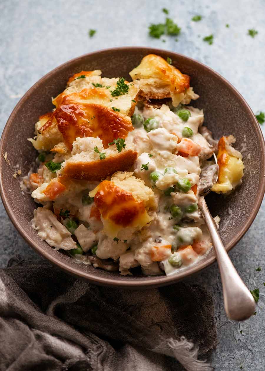 Leftover Turkey Pot Pie with garlic bread topping in a bowl, ready to be eaten