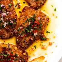 Close up overhead photo of Mediterranean Crusted Sardines on a plate, ready to be served