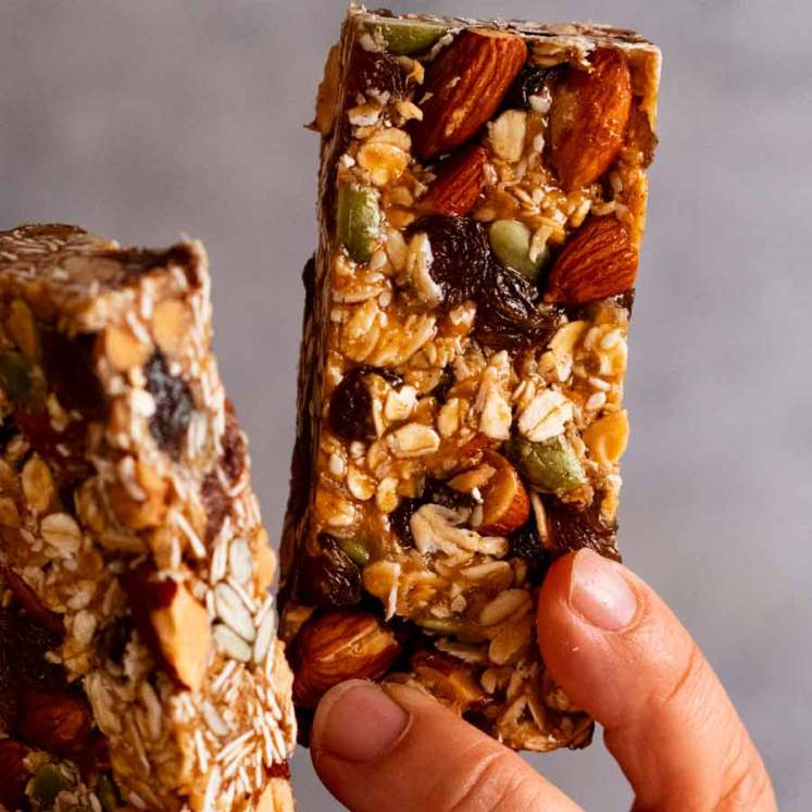 Hand holding Muesli bars (granola bars)