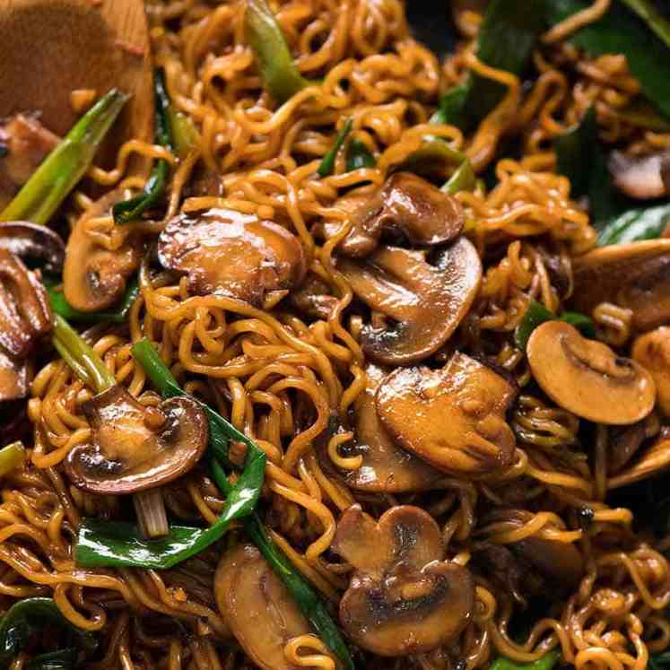 Close up of Asian Mushroom Ramen Noodles in a black skillet, fresh off the stove