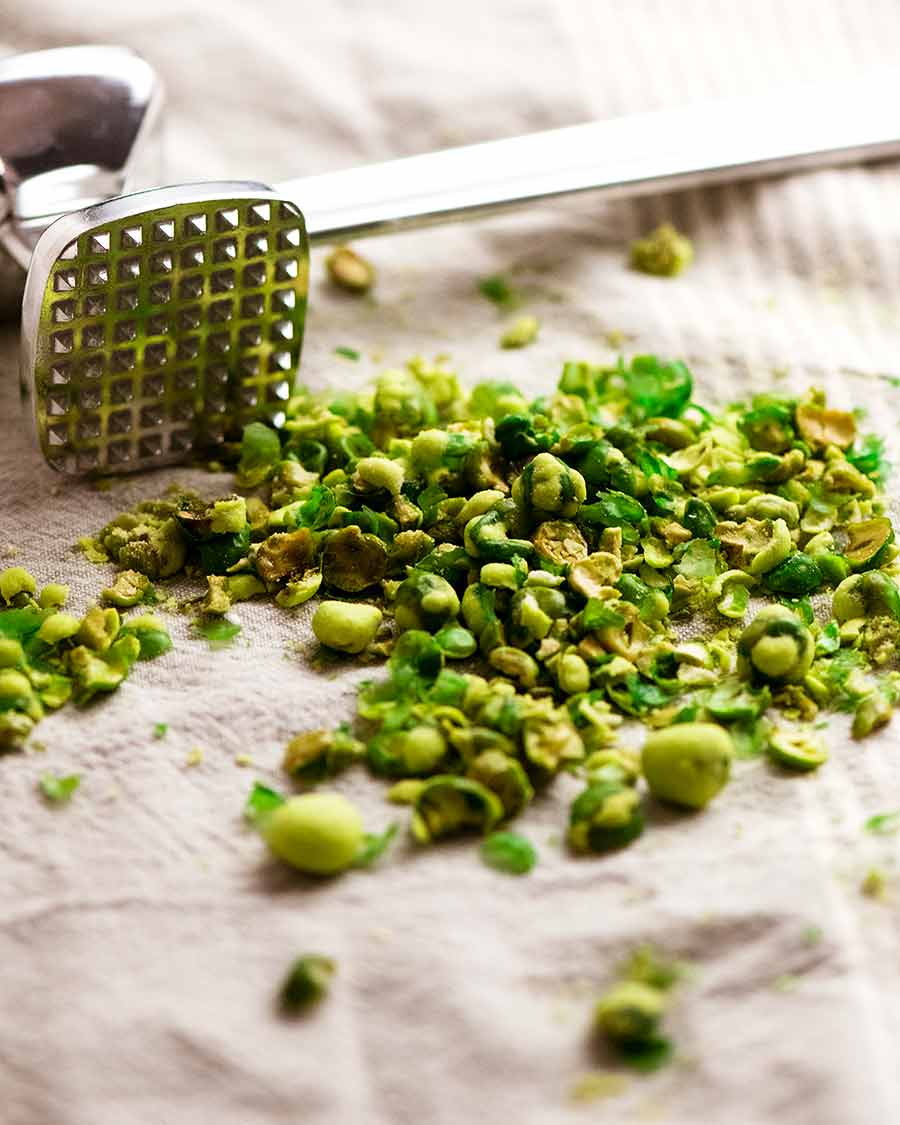 Smashed wasabi peas on a tea towel