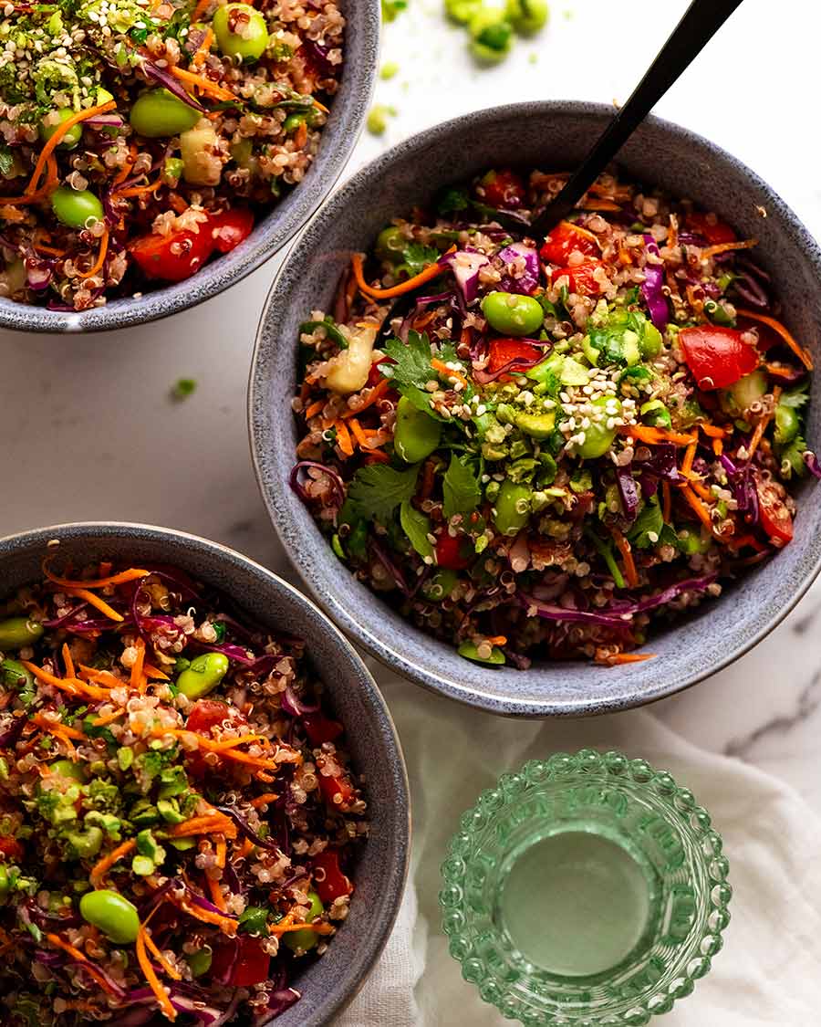 Overhead photo of 3 bowls filled with Quinoa Salad