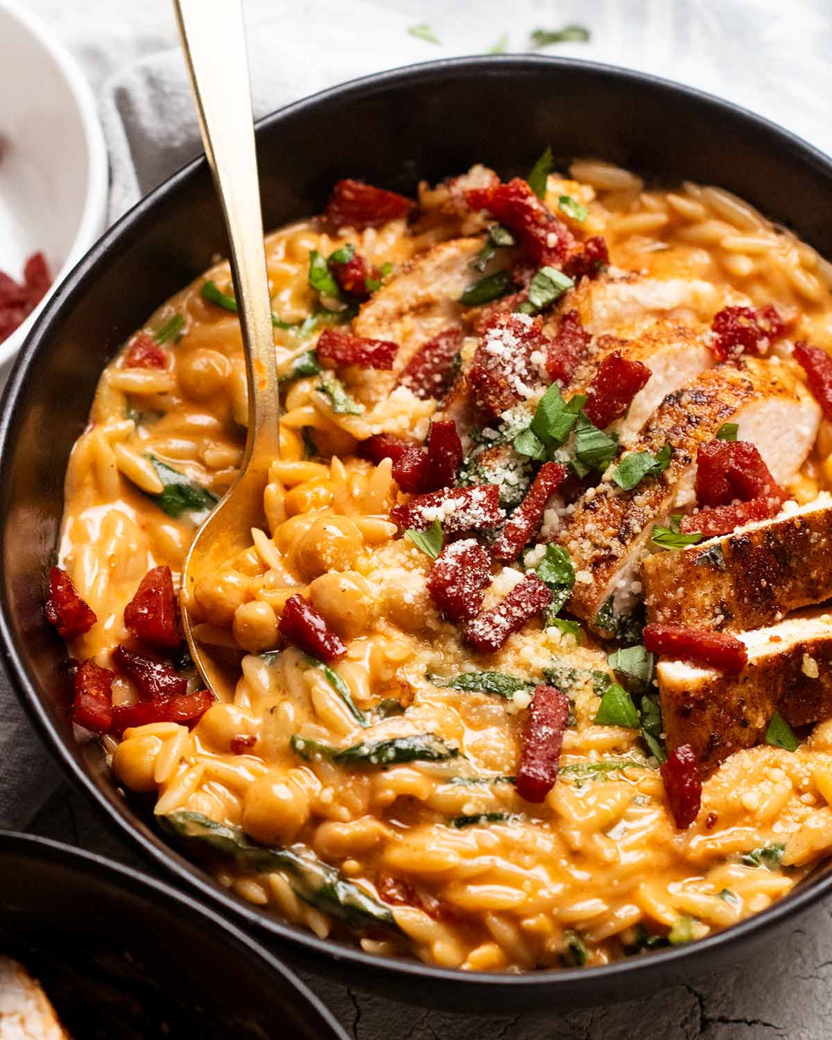 One pan chicken creamy tomato risoni with crispy salami (orzo)