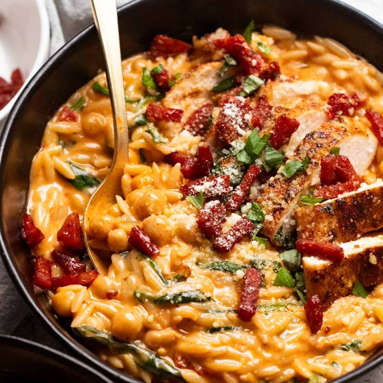 One pan chicken creamy tomato risoni with crispy salami (orzo)