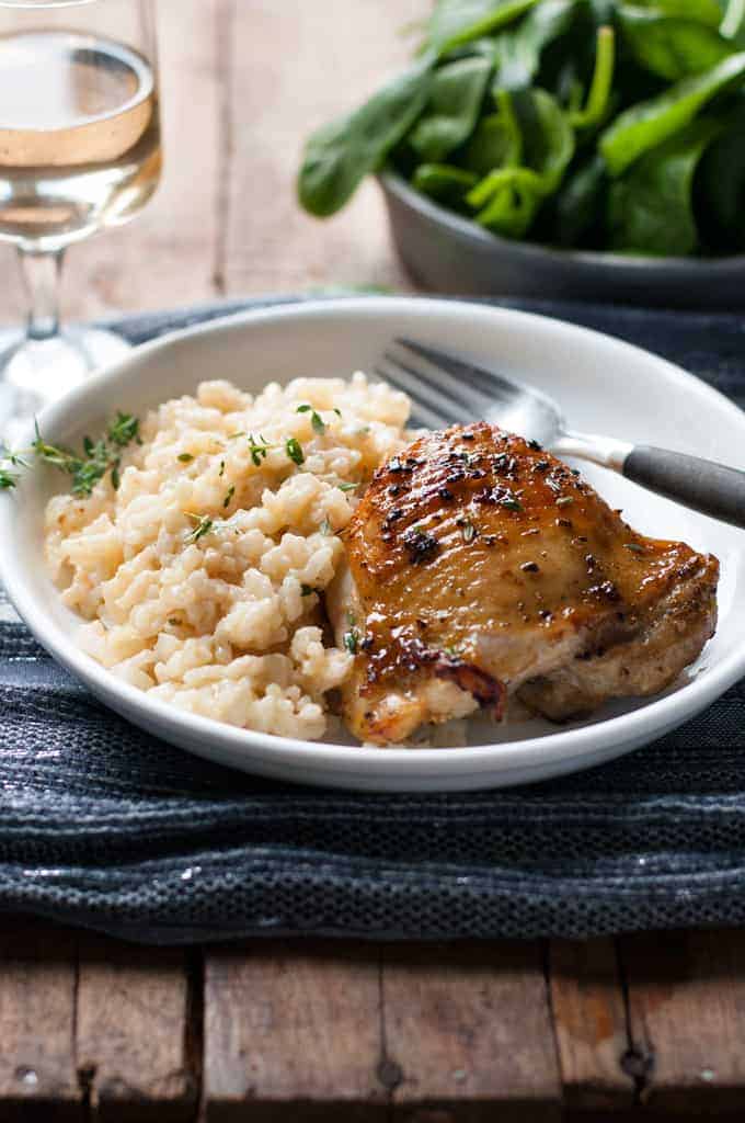 One Pot Creamy Baked Risotto with Lemon Pepper Chicken served on a plate