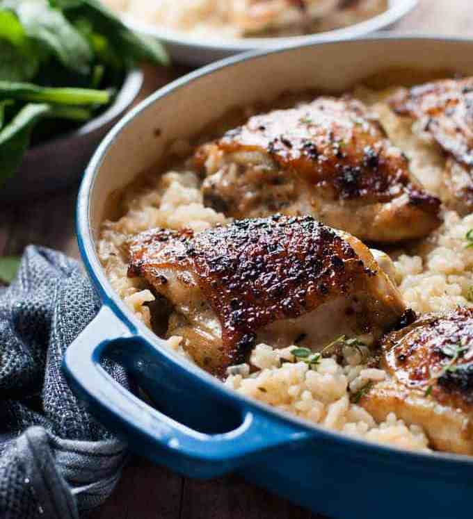 One Pot Creamy Baked Risotto with Lemon Pepper Chicken in a blue pot