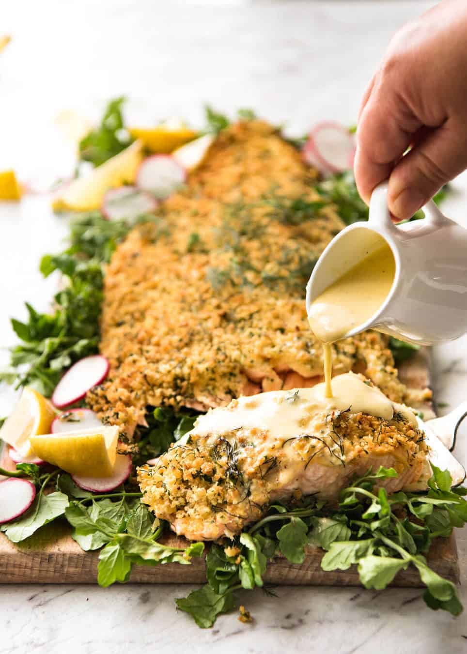 Baked Parmesan Crusted Salmon with Lemon Cream Sauce - easy and fast to make, can be prepared ahead, a stunning centrepiece for Christmas dinner and yet easy enough for midweek. That Lemon Cream sauce is the perfectly finishing tough. www.recipetineats.com