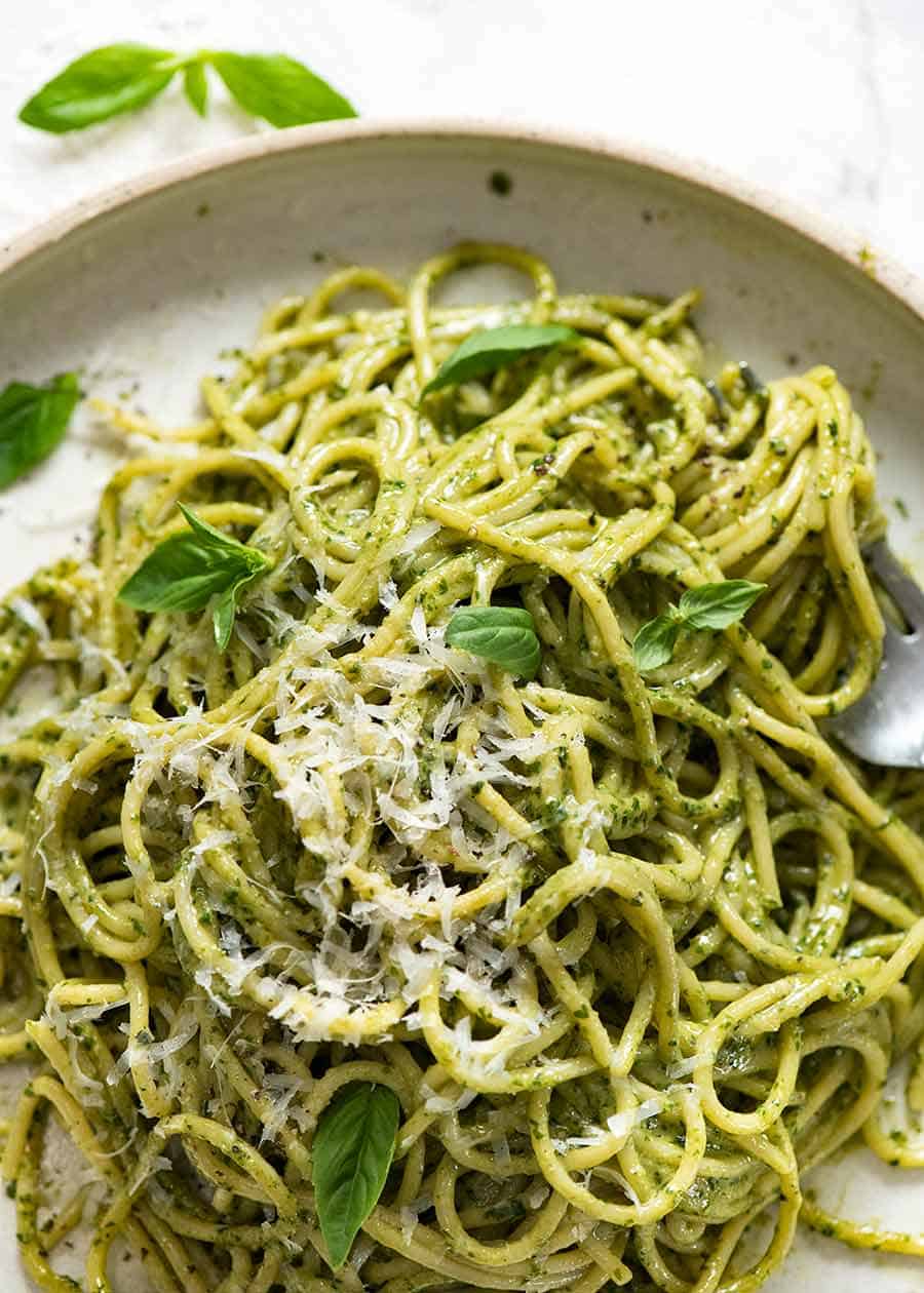 Pesto pasta spaghetti on a plate, ready to be eaten