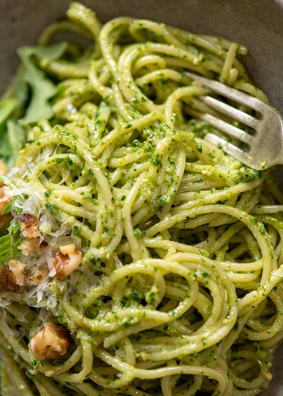 Close up of Rocket walnut pesto pasta in a rustic bowl, ready to be eaten