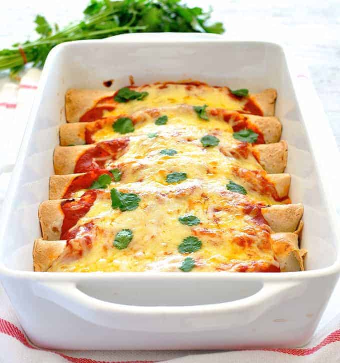 Pulled Pork Enchiladas - Amazing enchiladas stuffed with pork carnitas and topped with a homemade Enchilada Sauce! recipetineats.com