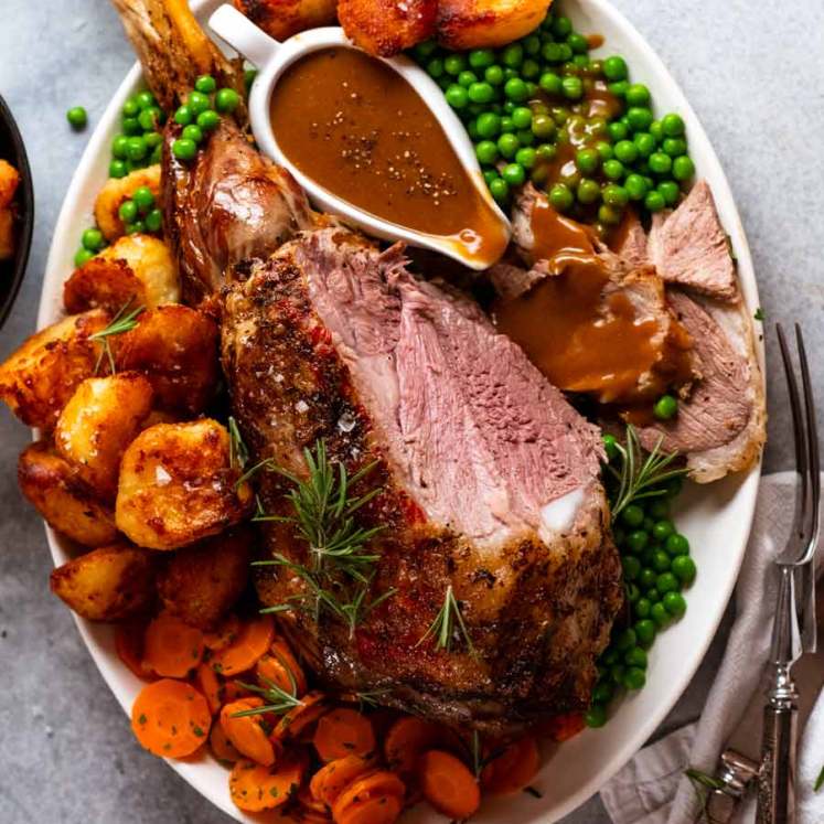 Roast lamb leg dinner with sides