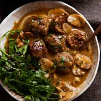 Salisbury steak meatballs served over mashed potato